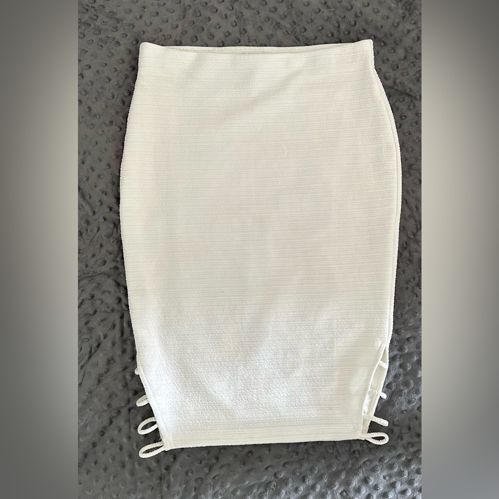 White pencil skirt with laser cut sides